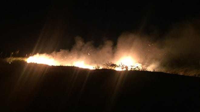 The brush fire on the dune near Mediterranean Road. Courtesy Palm Beach Fire-Rescue.