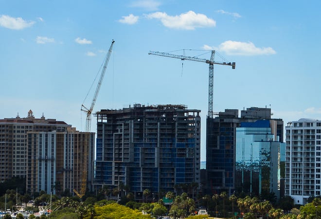 Cranes above the skyline signify the continuing development of downtown Sarasota. [STAFF PHOTO / DAN WAGNER]