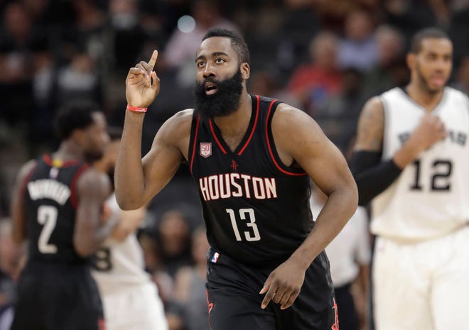 Houston Rockets guard James Harden agreed to a four-year contract extension for about $160 million on Saturday, giving him a total six-year deal with $228 million guaranteed. (The Associated Press)