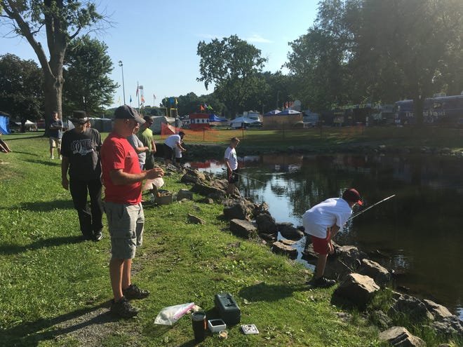 TIMES-REPORTER HANK KEATHLEY

Competitors lined the banks of the pond at Tuscora Park on Tuesday for the fishing derby, which was held as a part of Family Day at the First Town Days festival. Prizes were awarded for biggest and smallest fish, first fish and most fish caught.