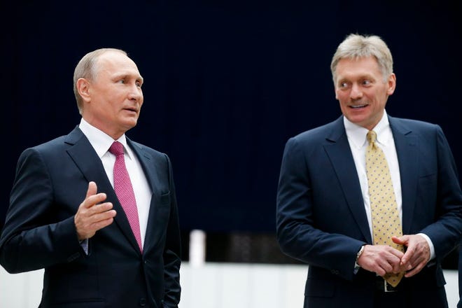 Russan President Vladimir Putin, left, with his spokesman, Dmitry Peskov