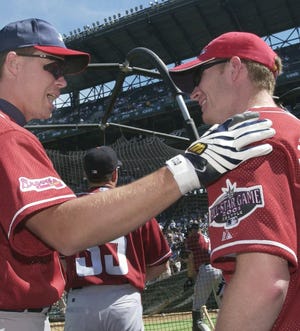Chipper Jones (left) talks with Dale Earnhardt Jr. during the National League batting practice before the 72nd All-Star game at Safeco Field in Seattle in 2001. [AP Photo/Mark J. Terrill]