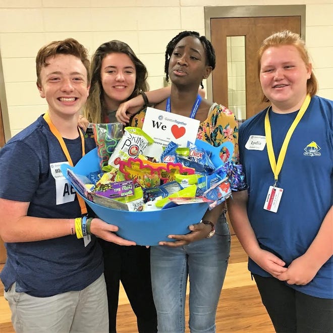 The winning team of the community forum presentations with Gaston Together poses with their basket of goodies. From left to right: Blaise Shiver, Sydney Bryson, Carrington Pearson and Lydia Bolick. [Gaston Together/Special to The Gazette]
