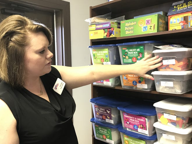 Childcare Aware Project Coordinator Erica Holland shows some of the tools used to help students Thursday, July 6, 2017 at Childcare Aware. [Alex Golden/Times Record]