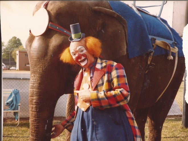 Dale Smith, as Herky the Clown, is pictured during a Kelly Miller Circus in 1989 with elephant, Mina. (Photo courtesy of Dale Smith)