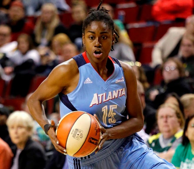 Atlanta Dream guard Tiffany Hayes, a Winter Haven grad, drives against the Seattle Storm in a game on June 13.