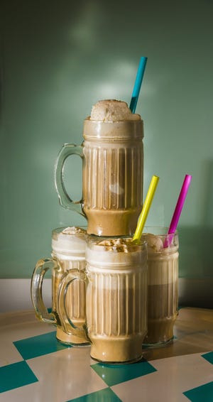 The cold-brew coffee float brings together four ounces each of cold-brew coffee concentrate and club soda, with two scoops of ice cream and, if so desired, a coffee liqueur. [Roy Inman/Kansas City Star/TNS]