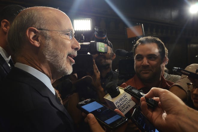 Gov. Tom Wolf speaks to reporters in his offices Wednesday, July 12, in Harrisburg, in his first public appearance after letting a nearly $32 billion budget bill become law without his signature. (AP Photo/Marc Levy)