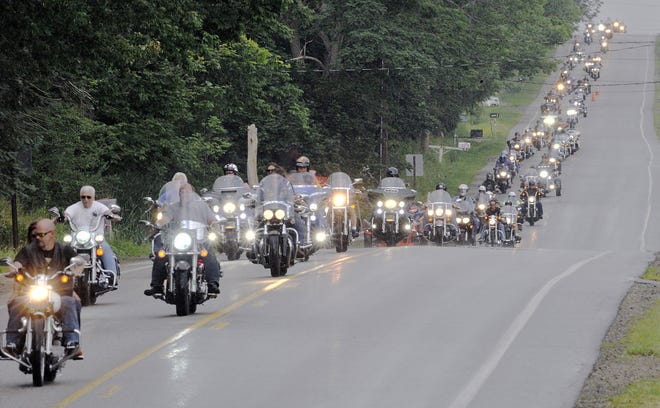 During the Fallen Riders Memorial Run, motocycles travel south on Station Road in Harborcreek Township Wednesday, the first day of Roar on the Shore. [GREG WOHLFORD/ERIE TIMES-NEWS]