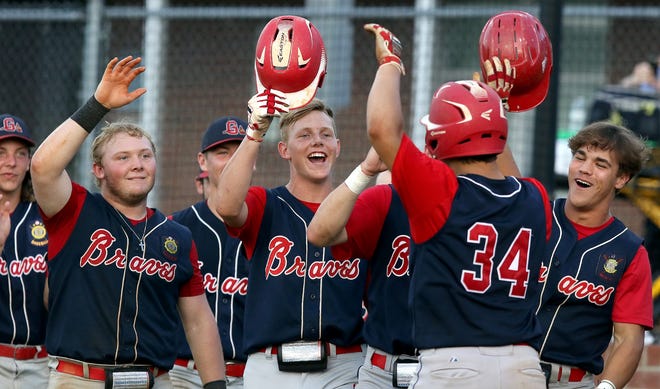 The Gaston Braves' Timmy Davila, 34, is congratulated by teammates after his three-run home run during their 19-5 rout of Cherryville Post 100 in the opener of their best-of-5 series Wednesday night at Cherryville. [JOHN CLARK/THE GASTON GAZETTE]