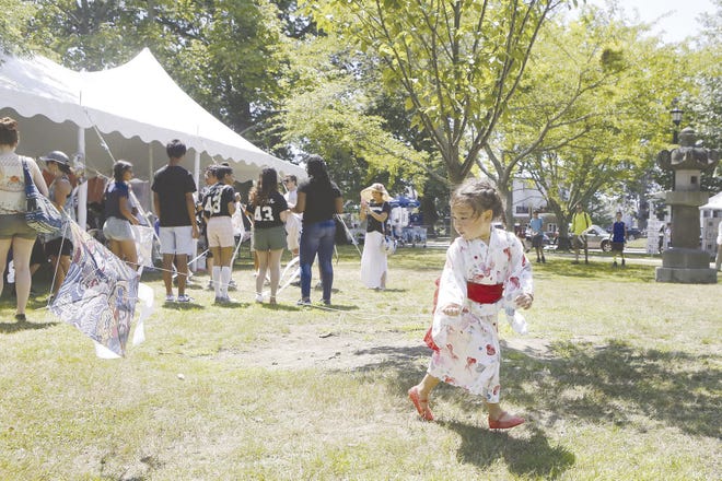Lily Villatoro of Japan flies a kite she made during last year’s Black Ships Festival at Touro Park in Newport. The festival begins on Thursday, although opening ceremonies will be held Friday at 10:30 a.m. at Touro Park.