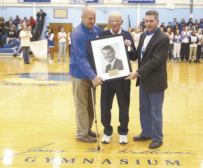 Former Middletown boys basketball coach Jim Williams is flanked by his son, Jim Williams Jr., right, and Paul Murphy during a ceremony in December. The gym at Middletown High School was named for the coach.