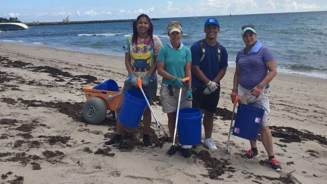 From left, Jazzman Lezama, Diane Buhler, Jullian Cathirell and Robyn Kennedy at a September beach cleanup organized by Friends of Palm Beach.