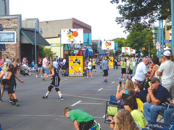 Phil Wenzel/The Sault News
This file photo shows fiercely fun competition during downtown Sault Ste. Marie’s Gus Macker tournament. This year’s event will begin with registration and a Special Olympics vs. Sault Middle School girls basketball team game Friday evening and continue with 3-on-3 games on Saturday and Sunday.
