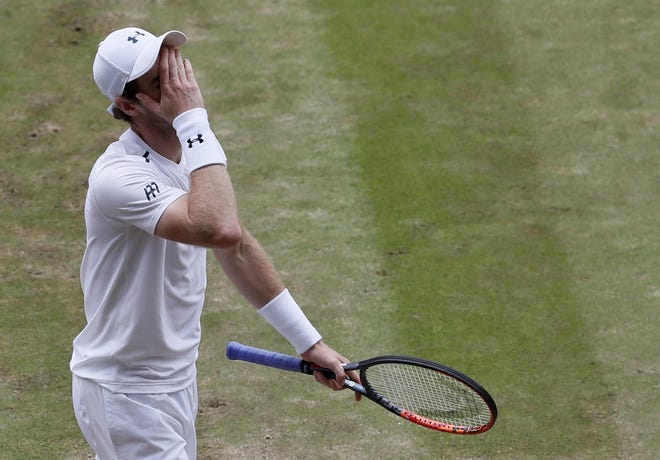 Britain's Andy Murray reacts after losing a point to Sam Querrey of the United States during their Men's Singles Quarterfinal Match on day nine at the Wimbledon Tennis Championships in London Wednesday, July 12, 2017. (AP Photo/Kirsty Wigglesworth)