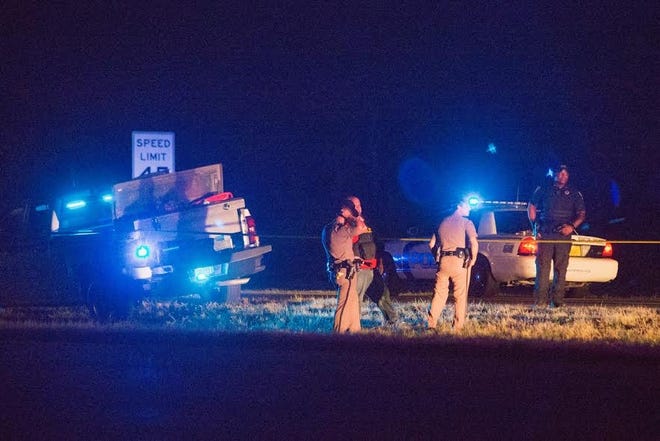 Law enforcement works the scene of a crash late Tuesday in Panama City Beach. [JOSHUA BOUCHER/THE NEWS HERALD]