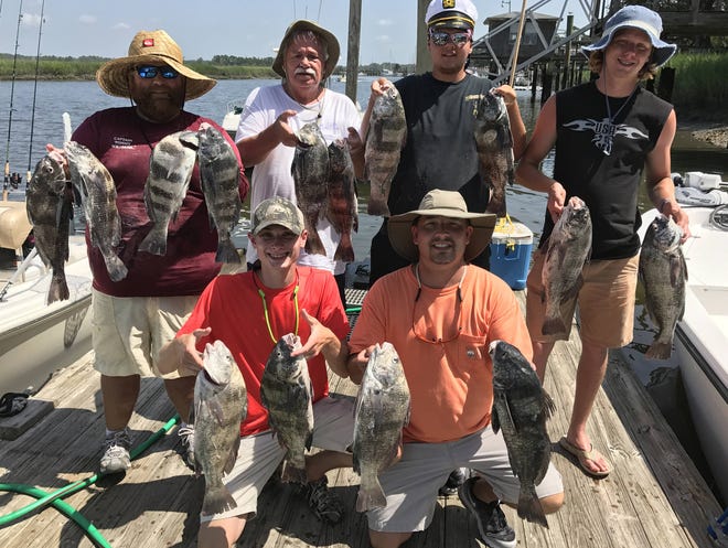 SPECIAL A quintet of Augusta fishermen had a great time catching black drum on July 4 while fishing with Miss Judy Charters of Savannah. Front row: Hunter (left) and Bo Thomas. Back row, from left: Charter Capt. Tommy Williams, Ken Sumner, Chase Maddox and Cody Canuette.