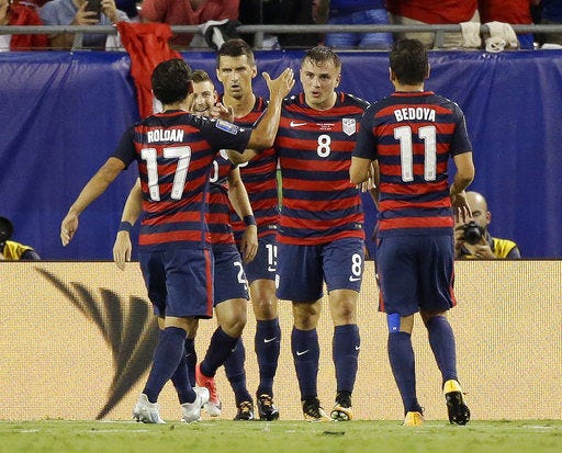 United States' Jordan Morris (8) celebrates after scoring a goal against Martinique with teammates including Cristian Roldan (17) and Alejandro Bedoya (11) during a CONCACAF Gold Cup soccer match, Wednesday, July 12, 2017, in Tampa, Fla. United States won 3-2. (AP Photo/John Raoux)