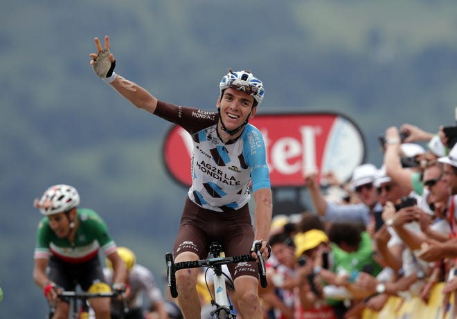 France's Romain Bardet celebrates as he crosses the finish line to win the twelfth stage of the Tour de France cycling race over 214.5 kilometers (133.3 miles) with start in Pau and finish in Peyragudes, France,Thursday. Italy's Fabio Aru, left, finished second. CHRISTOPHE ENA/THE ASSOCIATED PRESS