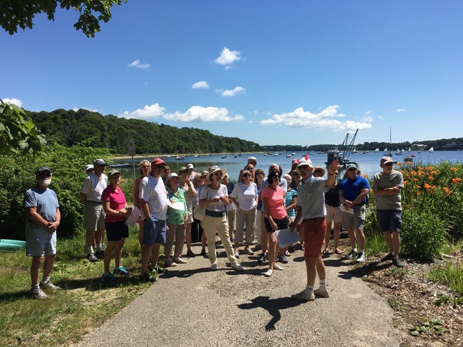 Local historian Tom Burgess leads the walking tour by Ropes Beach. [PHOTO BY MARINA DAVALOS]