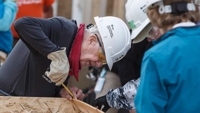In this Tuesday, July 11, 2017 photo, former President Jimmy Carter helps build homes for Habitat for Humanity in Edmonton Alberta. (Jason Franson/The Canadian Press)