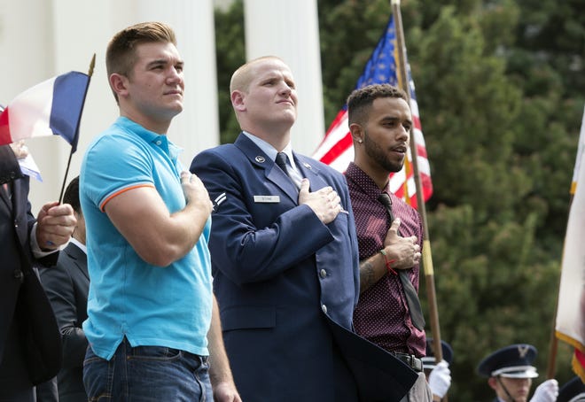 In this Sept. 11, 2015, file photo, Oregon National Guardsman Alek Skarlatos, left, U.S. Airman Spencer Stone, center, and Anthony Sadler attend a parade held in Sacramento, California, to honor the three Americans who stopped a gunman on a Paris-bound passenger train. The three Sacramento-area men who thwarted a terror attack on a French train in 2015 will play themselves in a Clint Eastwood-directed film about their heroic feat. Sadler, Skarlatos and Stone will star in "15:17 to Paris," which began production this week. [FILE PHOTO/ASSOCIATED PRESS]