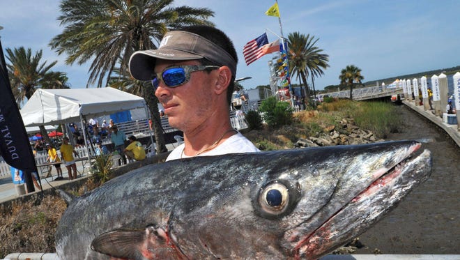Dillon Drury carries a 35.75 lb. kingfish to the weigh-in at last year’s Greater Jacksonville Kingfish Tournament. (The Florida Times-Union, Bob Mack)