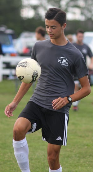 Dixon defender Harrison Martin warms up before a recent summer league match at the Swansboro Soccer Complex. Martin hopes to bounce back this season after he broke two bones in his leg late last season. [Chris Miller/The Daily News]