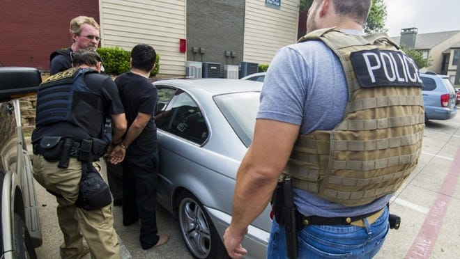 In this June 6 photo, federal agents in Dallas participate in a targeted ICE operation that resulted in 70 arrested in the Dallas and Oklahoma areas during 3-day ICE operation. (Courtesy of U.S. Immigration and Customs Enforcement)