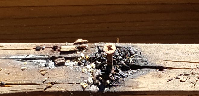 Deck rot occurring in treated wood around a screw [Tim Carter/Tribune Contenct Agency]