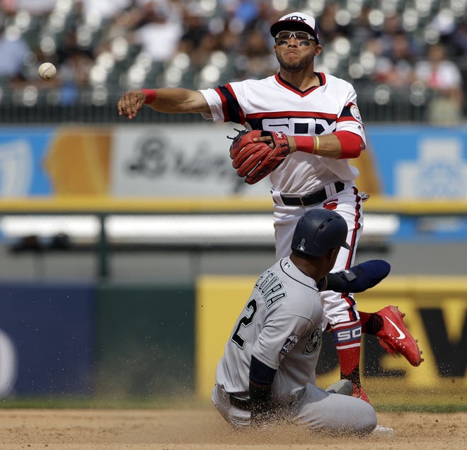 Chicago White Sox second baseman Yolmer Sanchez, top, throws out Seattle Mariners' Danny Valencia at first after forcing out Jean Segura, bottom, at second during the ninth inning of a baseball game Sunday, July 16, 2017, in Chicago. [NAM Y. HUH/AP PHOTO]