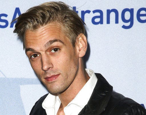 FILE - In this Nov. 9, 2015, file photo, singer Aaron Carter arrives at a premiere of "Saints & Strangers" at the Saban Theater in Beverly Hills, Calif. Authorities said Carter and his girlfriend Madison Parker were arrested Saturday, July 15, 2017, on DUI and drug charges in Georgia. (Photo by Rich Fury/Invision/AP, File)