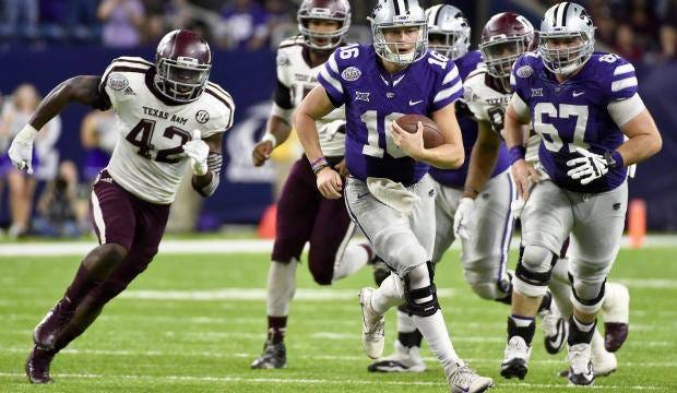 Kansas State quarterback Jesse Ertz, center, scampers past Texas A&M linebacker Otaro Alaka, left, during the second half of the Texas Bowl, where he accounted for three touchdowns and was the game’s MVP. Ertz is unlikely to receive a medical redshirt after injuring his knee on the first play of the 2015 season and is embracing what is expected to be his final season with the Wildcats. (File photo/The Associated Press)