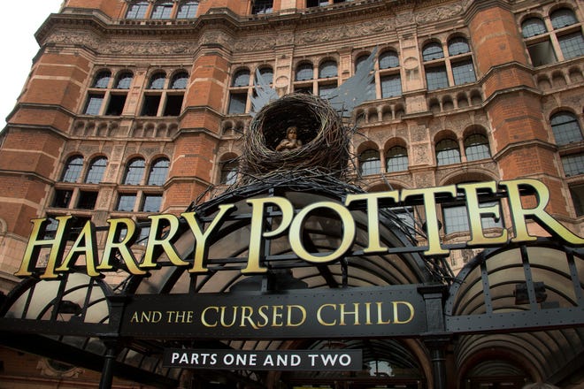 FILE - This July 30, 2016, file photo shows the Palace Theatre in central London which is showing a stage production of, "Harry Potter and the Cursed Child." Harry Potter publisher Bloomsbury announced July 18, 2017, that two new books from the Harry Potter universe are set to be released in October as part of a British exhibition that celebrates the 20th anniversary of the launch of the series. (Photo by Joel Ryan/Invision/AP, File)