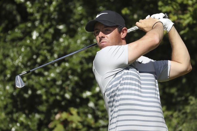Rory McIlroy hits a shot from the 5th tee during a practice round on Tuesday ahead of the British Open at Royal Birkdale in Southport, England. The former top-ranked golfer hopes to make a run at this week's Open. [AP Photo/Peter Morrison]