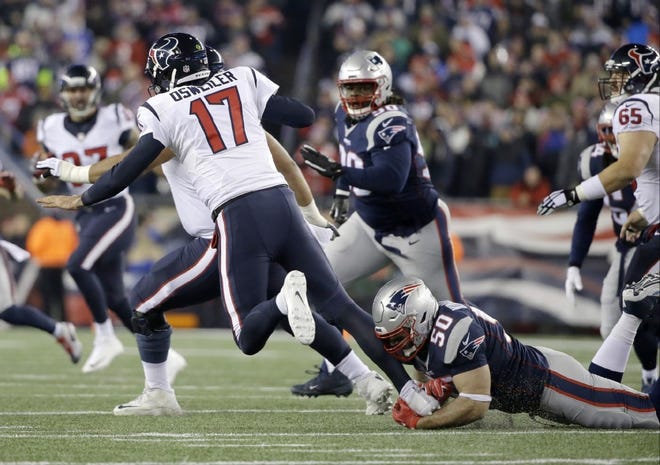 Rob Ninkovich (50) sacks Houston 
quarterback Brock Osweiler during the first half of January's playoff game in Foxboro.
