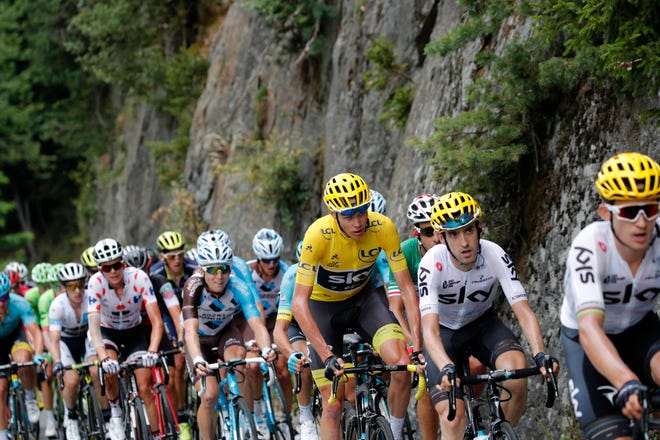 Britain’s Chris Froome is wearing the overall leader’s yellow jersey after the 17th stage of the Tour de France cycling race over 183 kilometers (113.7 miles) with start in La Mure and finish in Serre-Chevalier, France on Wednesday. (AP Photo/Christophe Ena)