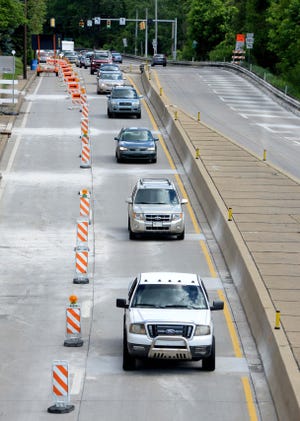 Cars navigate construction recently on Route 65.