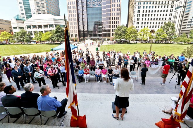 Ohio Lt. Governor Mary Taylor (at podium, back to camera) speaks out against Planned Parenthood during a protest on the west side of the Ohio Statehouse on Tuesday, July 28, 2015. (Columbus Dispatch photo by Fred Squillante)