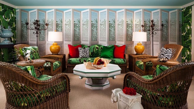 In a Palm Beach pool cabana, Dorothy Draper & Co. used a variety of throw pillows to accent wicker furnishings, including solid colors, botanical patterns and animal prints. Photo by Sargent Architectural Photography, courtesy Dorothy Draper & Co.