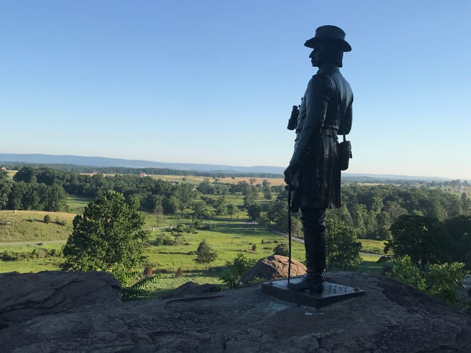 A statue of Union Gen. G.K. Warren surveys the view from Little Round top. (Rick Holmes)
