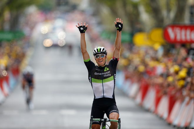 Norway's Edvald Boasson Hagen celebrates as he crosses the finish line to win the 19th stage of the Tour de France over 138.3 miles with the start in Embrun and finish in Salon-de-Provence, France, Friday, July 21, 2017. [AP Photo/Peter Dejong]