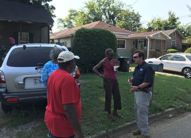 Tuscaloosa County Metro Homicide Unit assistant commander Capt. Kip Hart discusses the investigation into Luther Williams' shooting death Friday morning. Williams' sister, Marietta Bucher, is to his left. [Staff photo / Stephanie Taylor]
