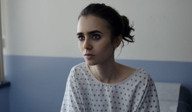 This image released by Netflix shows Lily Collins in, “To The Bone.” (Netflix via AP)