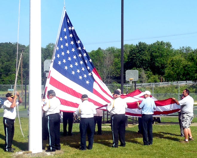 GateHouse Ohio Media / Ray Booth

The Honor Guard from the Newcomerstown American Legion assisted in the dedication of the new 12x18 flag at Cy Young Park.