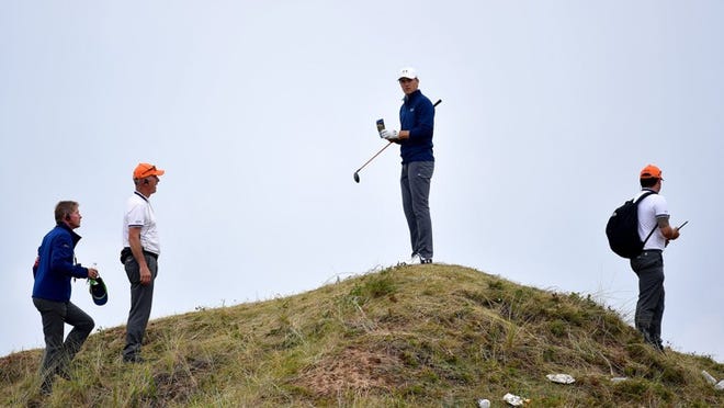 Jordan Spieth of the United States stands on a dune and considers his options on the 13th hole during the final round of the 146th Open Championship at Royal Birkdale on Sunday in Southport, England. STUART FRANKLIN/GETTY IMAGES