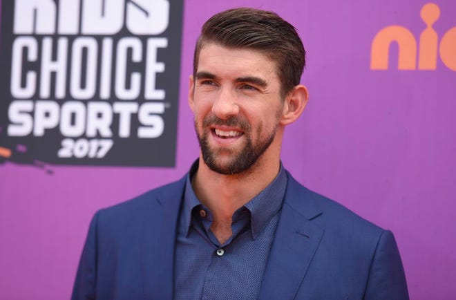 In this July 13, 2017 file photo, retired Olympic swimmer Michael Phelps arrives at the Kids' Choice Sports Awards at UCLA's Pauley Pavilion in Los Angeles. Phelps lost to a shark in the Discovery Channel's Shark Week special “Phelps vs. Shark: Great Gold vs. Great White," which aired on July 23, 2017. It was billed as a race between Phelps and the predator but much to the disappointment of some Twitter users, Phelps didn't actually swim in the water next to the shark.