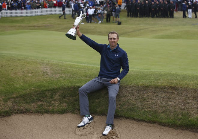 Jordan Spieth of the United States holds the trophy after winning the British Open Golf Championship at Royal Birkdale in Southport, England on Sunday. [AP Photo/Dave Thompson]