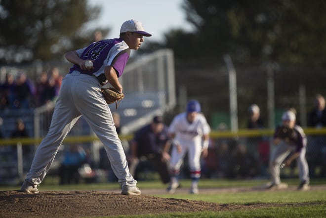 Lutheran's Reed Butz (14), shown pitching in the 2017 Class 3A baseball sectional semifinal, recently helped free two men from an overturned truck by bashing in a window with his baseball bat during a fierce storm. [RRSTAR.COM FILE PHOTO]