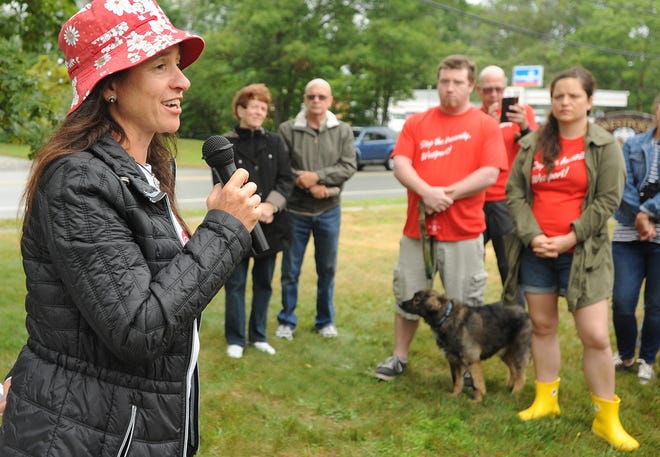 Wendy Taylor, director of West Place Animal Sanctuary, tells the dozens gathered how some of the animals from the Westport tenant farm are faring at her Little Compton place. [JACK FOLEY/HERALD NEWS]